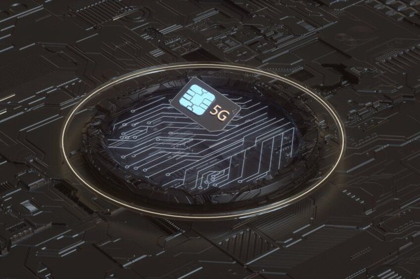 A circular, high-tech device with a 5G symbol on it, surrounded by a glowing ring. 4