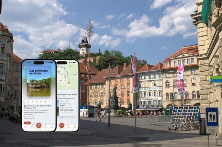 A smartphone displaying a map and a scenic view of a town square with historic buildings and flags. 1