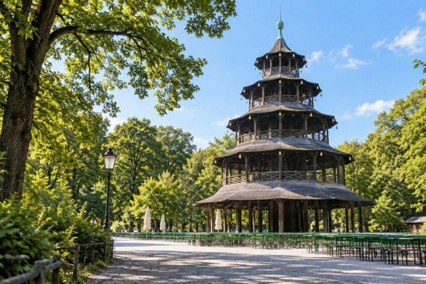 A pagoda-style pavilion in a park with trees and a clear sky. 3
