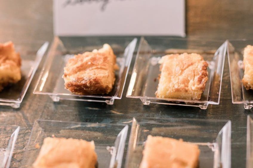 A display of desserts in clear plastic holders. 2