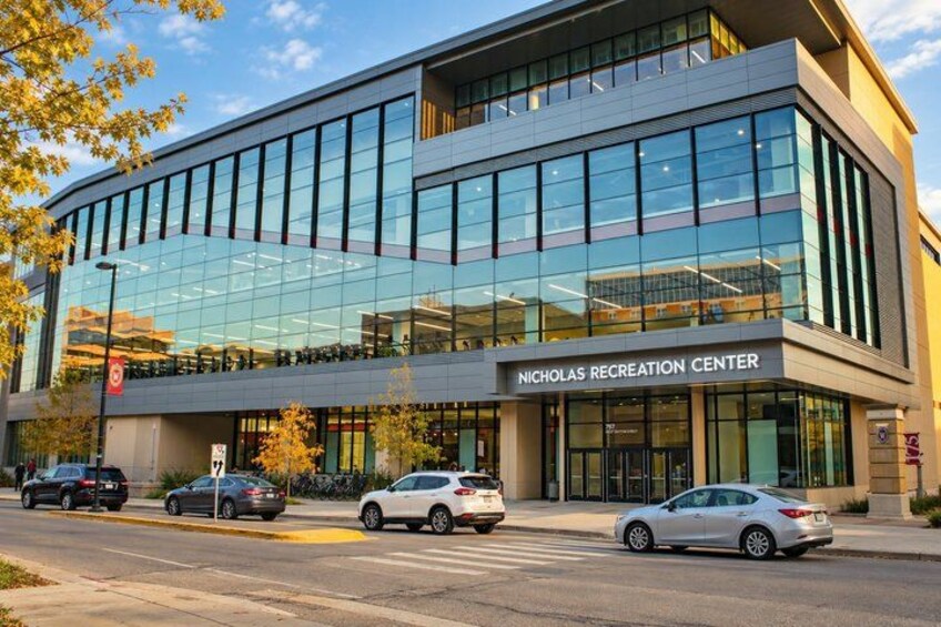 A modern building with a glass facade and the sign 'Nicholas Recreation Center'. 2