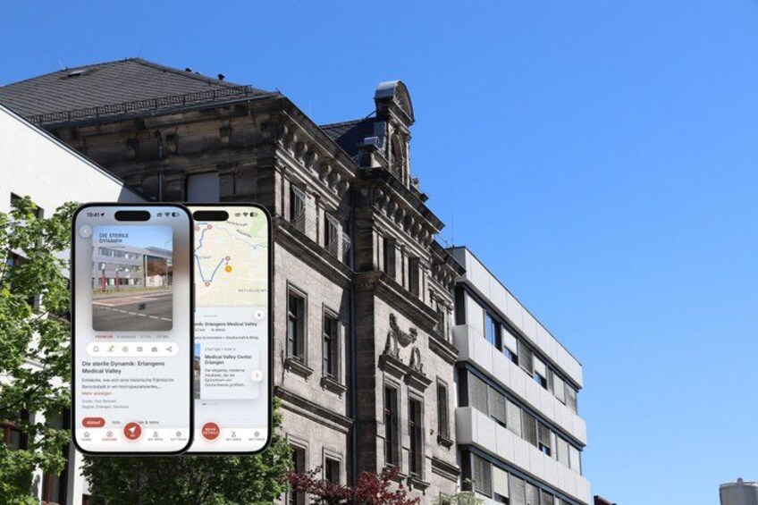 A historic building with classical architecture, a smartphone displaying a map, and a sign with information about the building. 1
