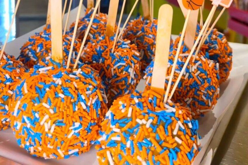 A tray of colorful, spherical treats with sticks, likely for easy handling. 2