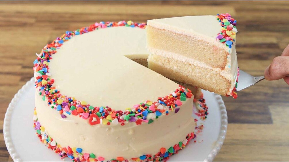 A cake with a slice being served. 4