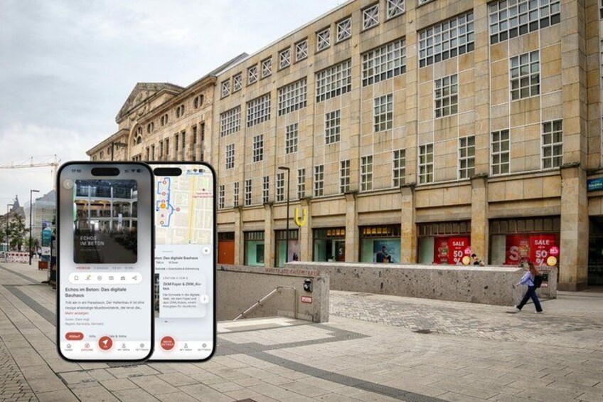 A smartphone displaying a map and a building with multiple storefronts. 1