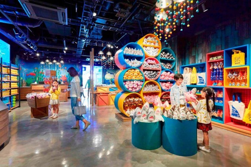 A brightly lit indoor shopping area with colorful displays and shelves. 4