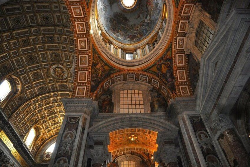 A grand architectural interior with a domed ceiling, ornate columns, and detailed frescoes. 3