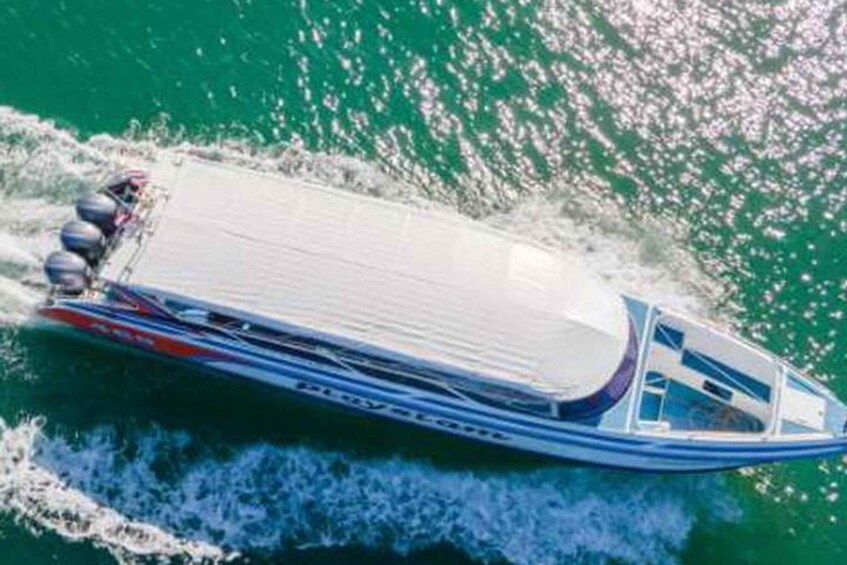 A speedboat with a white canopy, blue and red accents, and multiple water jets. 1