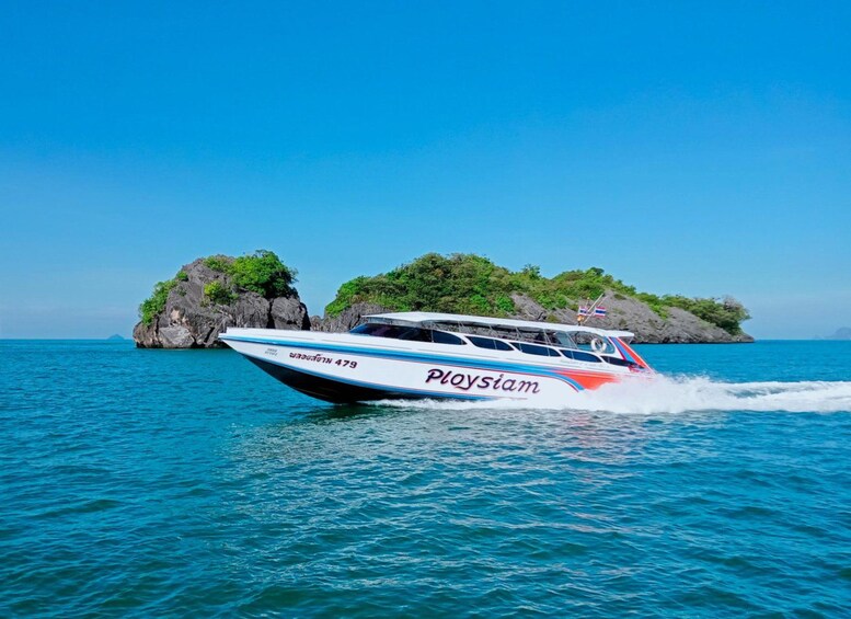 A speedboat named 'Ploysiam' with the number 479 on the water. 5