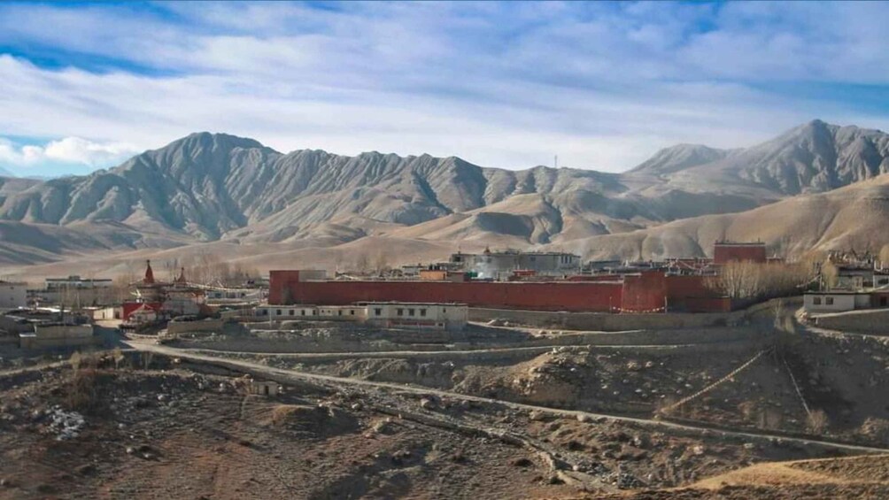 A mountainous landscape with a monastery complex. 2