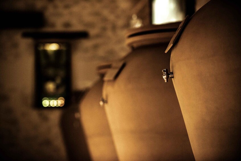 Large, cylindrical tanks in a dimly lit room. 2