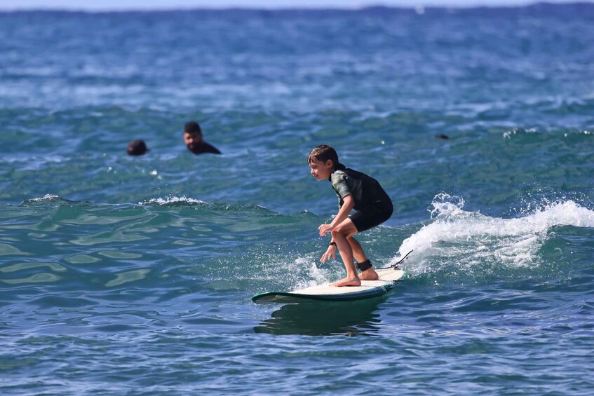 A person surfing on a wave in the ocean. 1