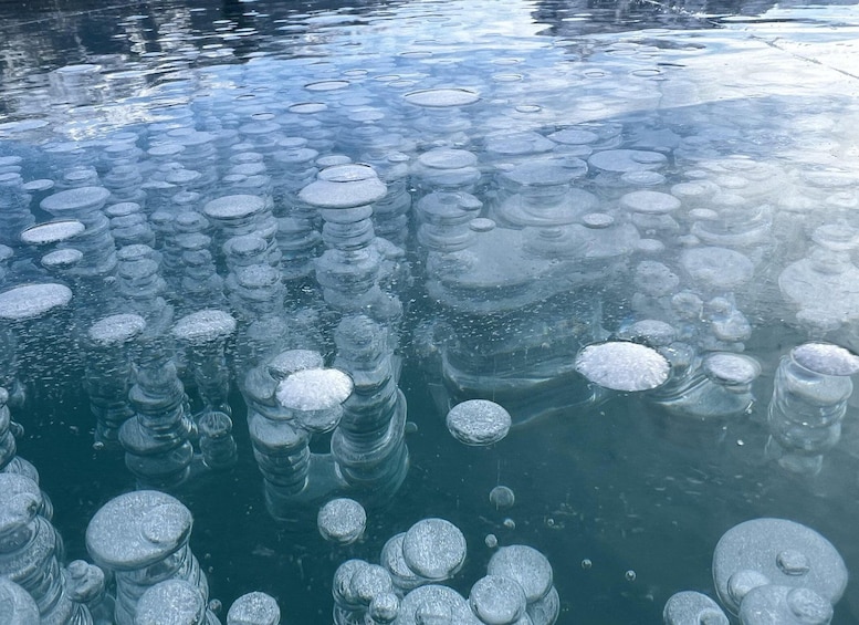 A frozen body of water with numerous ice formations. 5