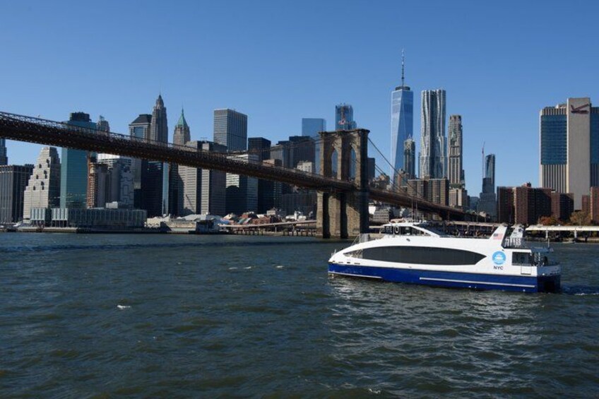 A river with a boat and a city skyline in the background. 5
