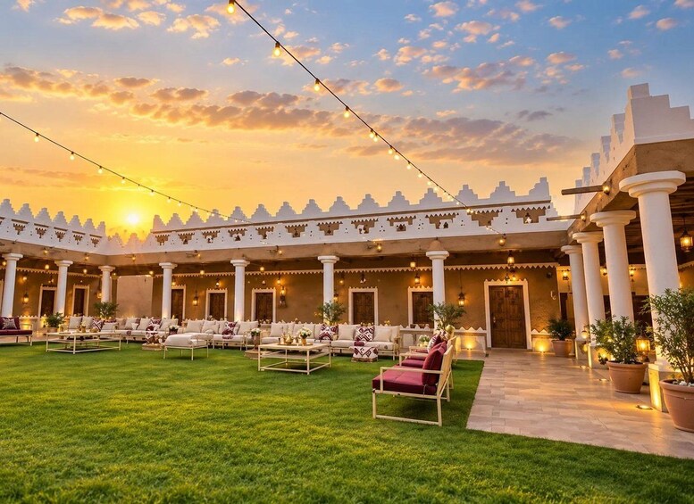 A courtyard with string lights, outdoor seating, and traditional architecture. 3