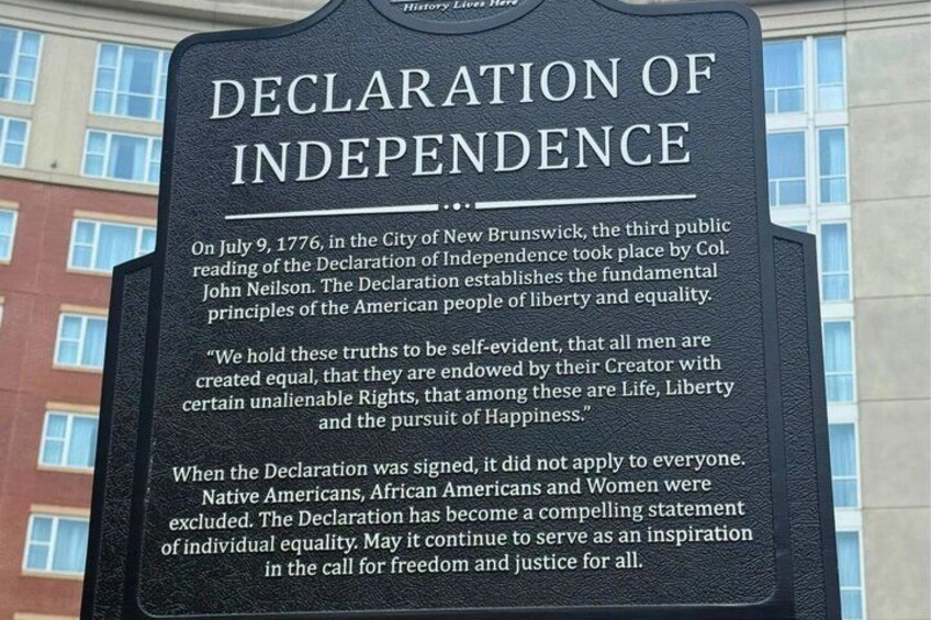 A historical sign with the text 'DECLARATION OF INDEPENDENCE' and details about its significance. 5