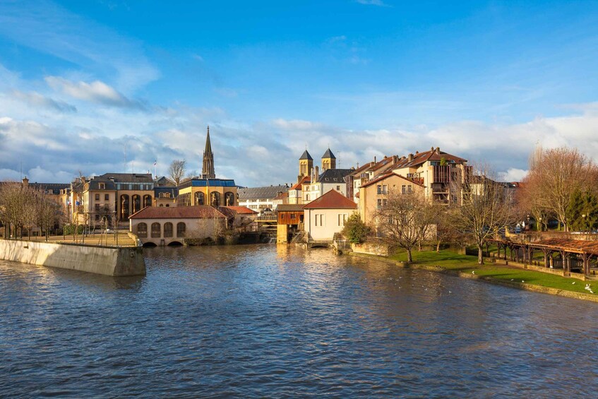 A river with buildings and a church in the background. 4