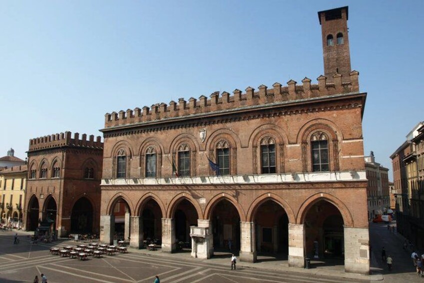 A historic building with arched windows and a tower. 3