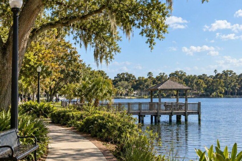 A lakeside gazebo, a walking path, and a bench. 2