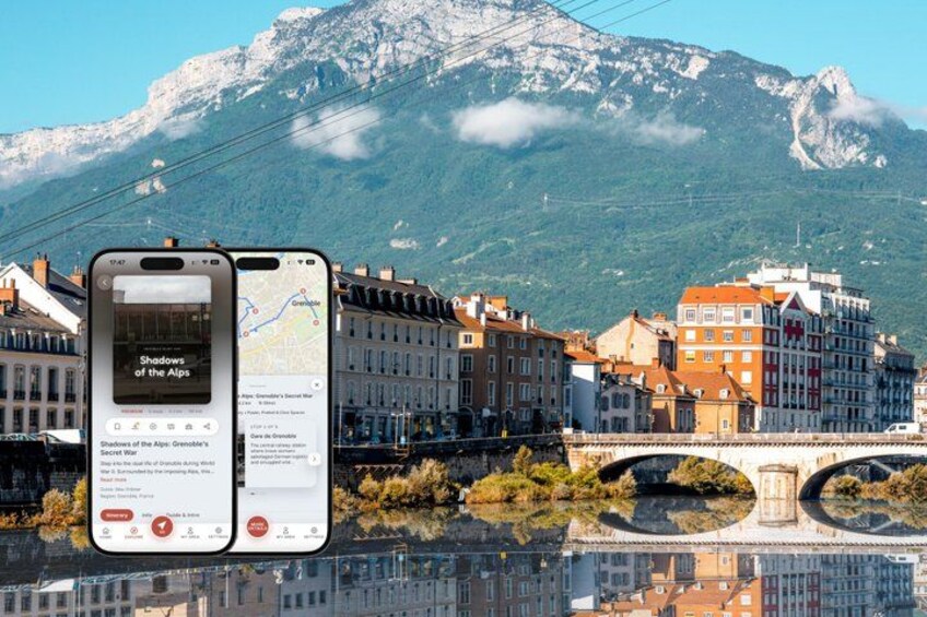 A smartphone displaying a map with a scenic view of a town, a bridge, and mountains in the background. 1