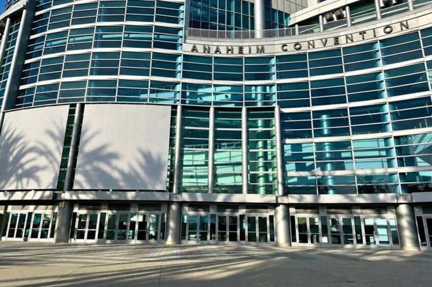 A modern building with the sign 'ANAHEIM CONVENTION' on the facade. 3