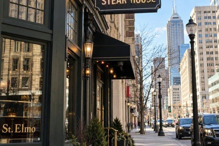 A street view with a restaurant named 'St. Elmo' and a sign for 'STEAR HOUSE.' 4