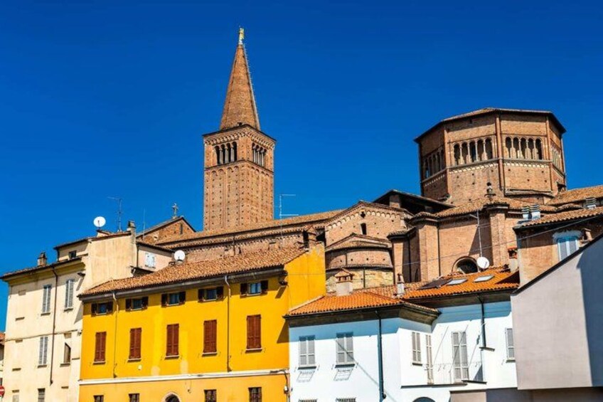 A historic building with a prominent tower and a dome. 2