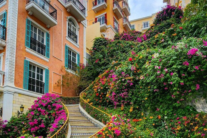 A staircase surrounded by vibrant flowers and lush greenery. 3