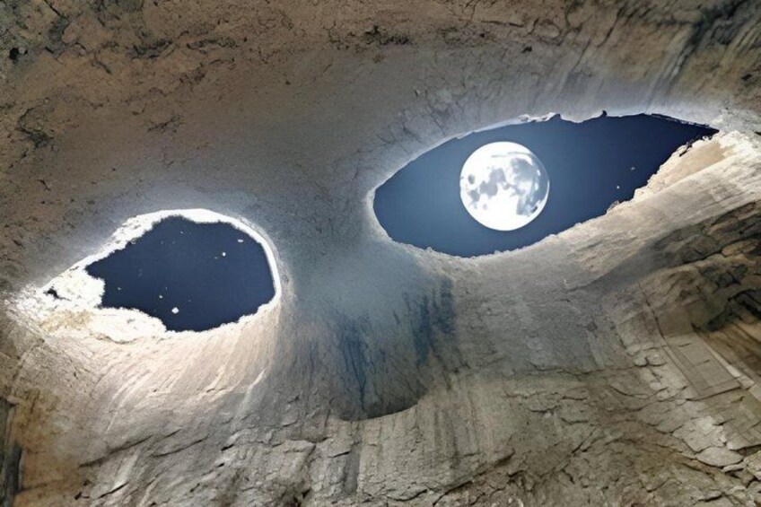 A cave with two moonlit openings. 1