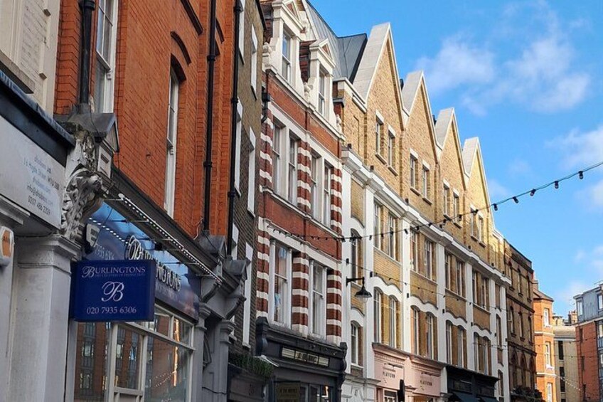 A row of terraced houses with a sign for Burlingtons. 1