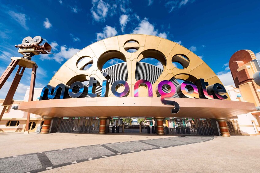 A large, circular building with the word "Motiongate" prominently displayed. 2