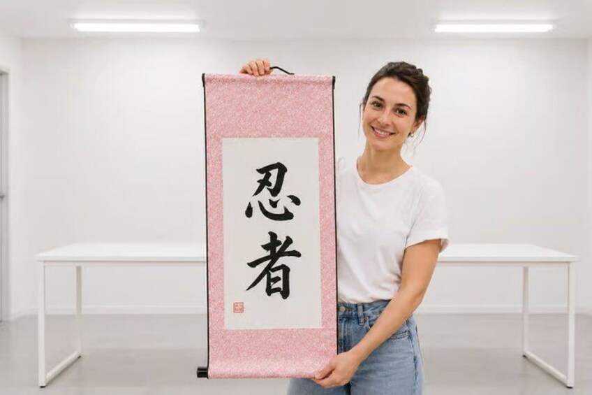 A person holding a scroll with Chinese characters. 1