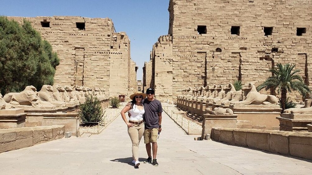 Couple walk the grounds of Karnak Temple