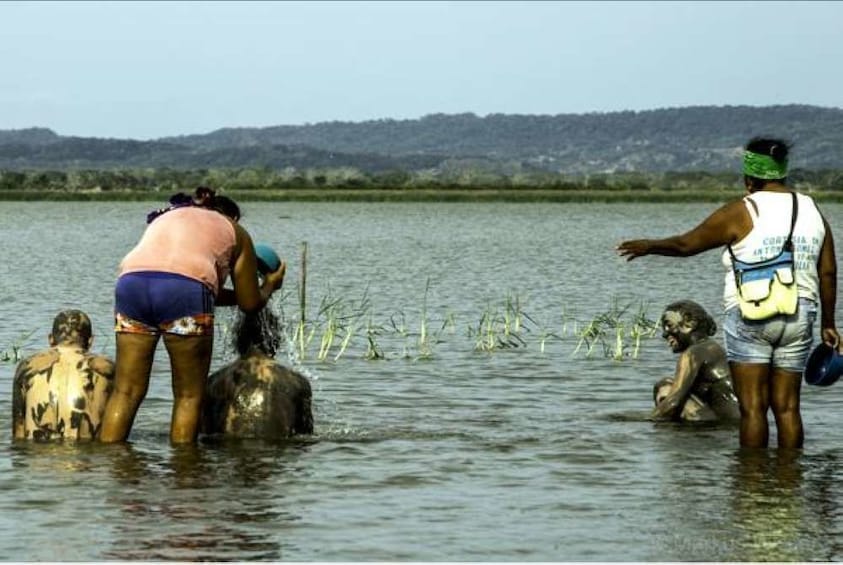 Group on a mud bath experience in Colombia