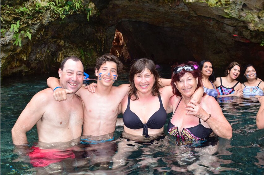 Tourists pose in the water in Punta Cana, Dominican Republic