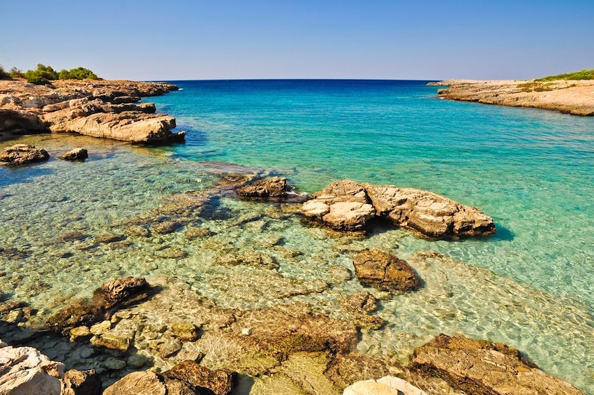 Clear blue water and rocks on the Salento Coast