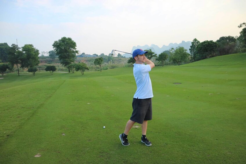 Man swings golf club at BRG Legend Hills Golf Resort 4