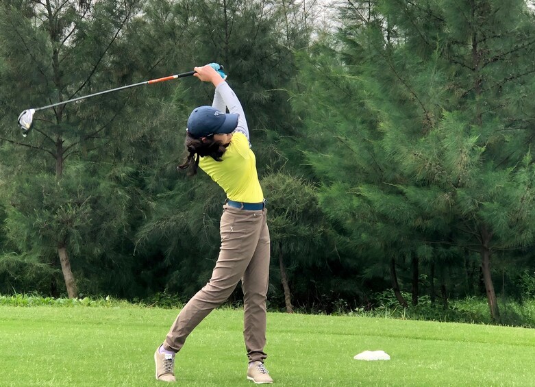 Golfer swings club  2