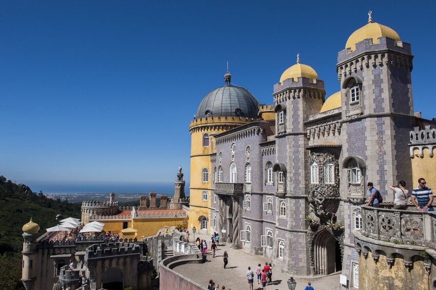 A historic building with domed roofs and intricate architecture. 5