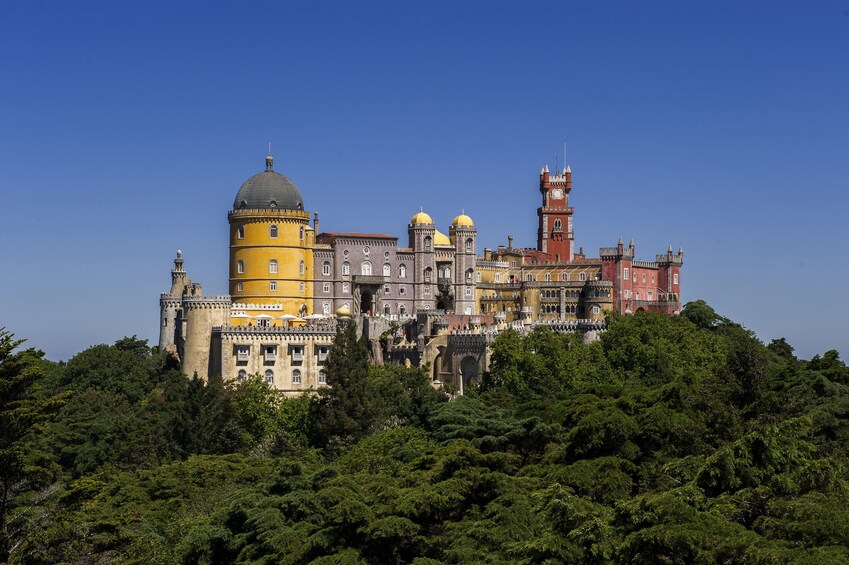 Pena Palace, a historic royal palace in Sintra, Portugal, surrounded by lush greenery. 4
