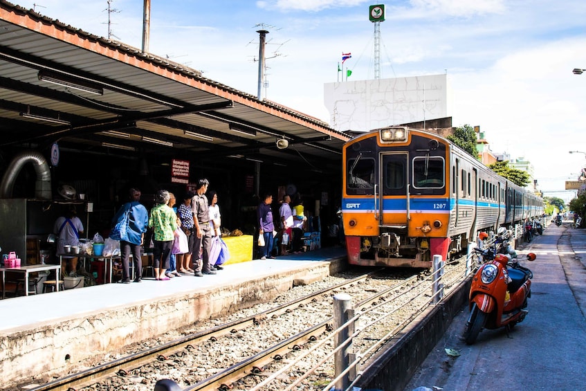 People wait for train in Bangkok