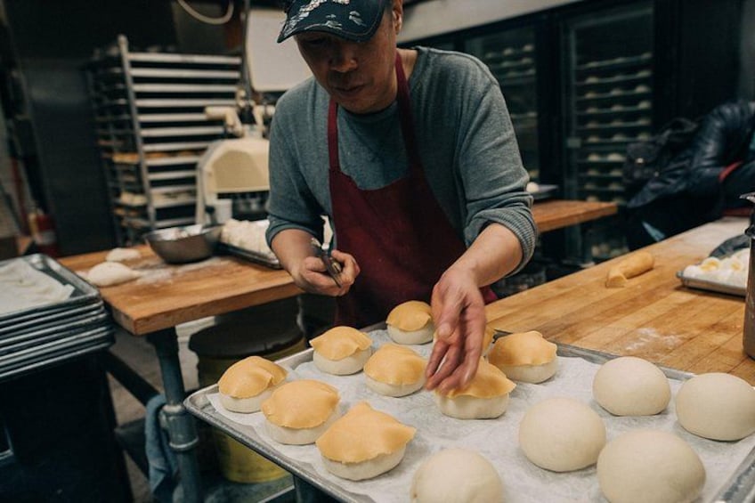 Artisan chefs craft each dish with skill and passion, a scene guests love watching during our Chinatown Food Tours. This behind-the-scenes magic adds flavor and excitement to Food Tours in Chinatown 2