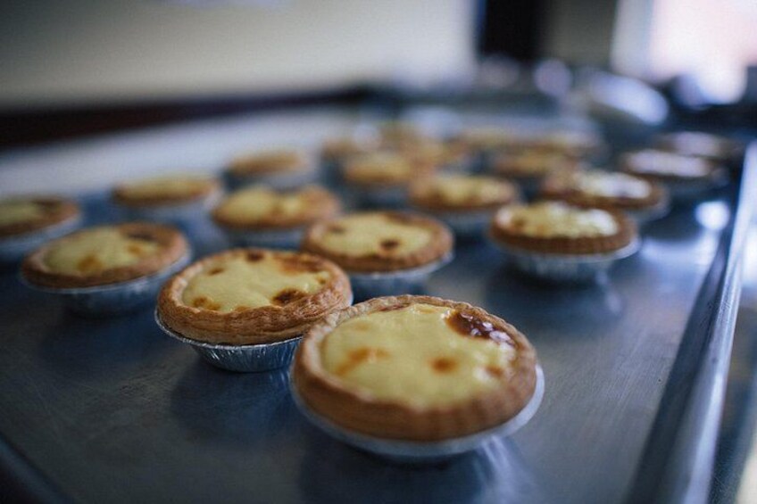 Portuguese egg tarts at Chiu Quon Bakery shine on our Chinatown Food Tours—flaky, warm, and silky-sweet. A delicious favorite on our Food Tours in Chinatown for every food lover. 2