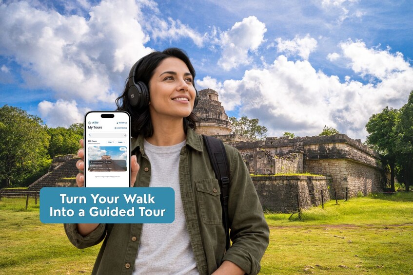 A person holding a smartphone with a travel app, standing in front of ancient ruins. 3