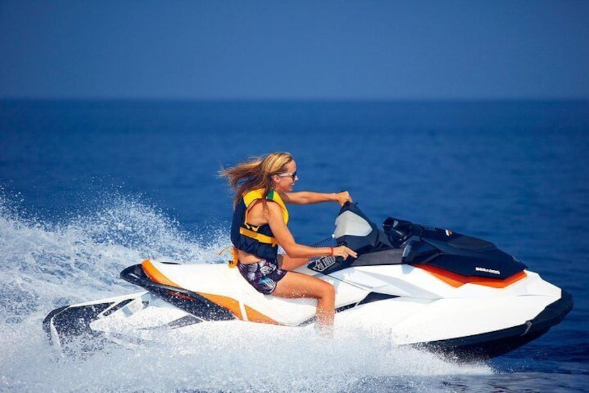 A person riding a jet ski on the water. 2