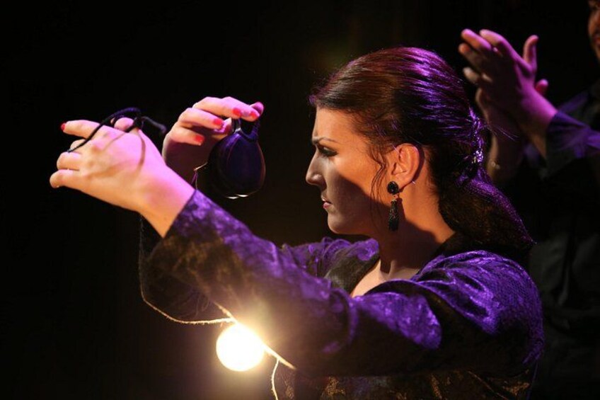 A person holding a microphone. 2