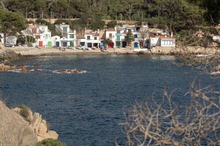 A coastal village with colorful houses by the sea. 2