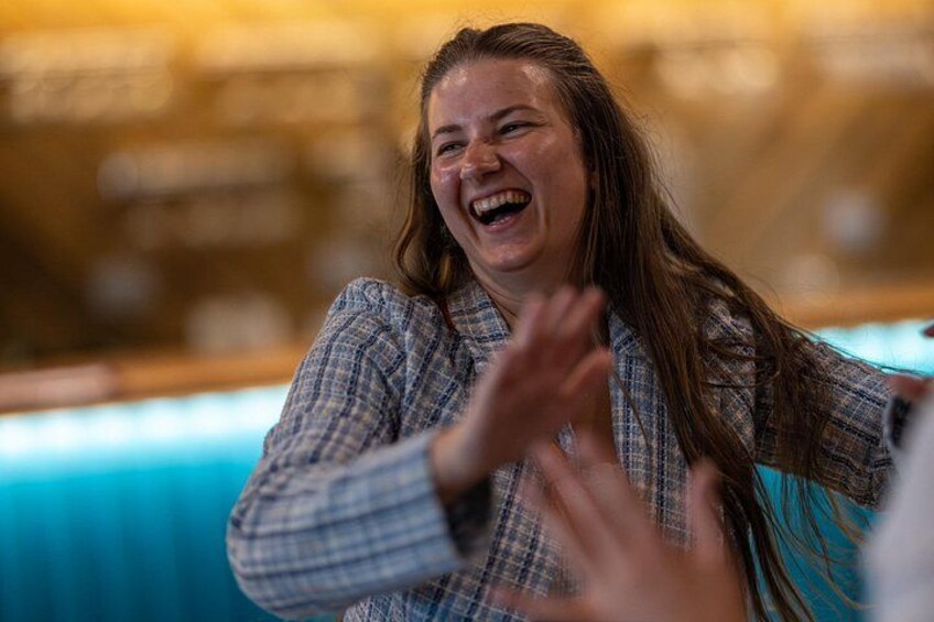 A person in a plaid shirt clapping. 2
