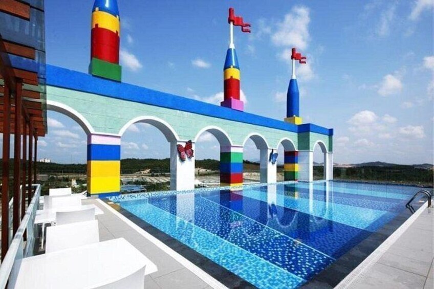A swimming pool with colorful structures and arches. 3
