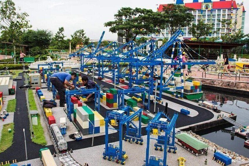 A model shipyard with miniature ships and cranes. 4